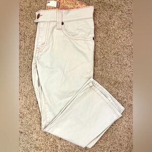 Levi's 542 mid rise light tan hipster Jeans w/ cool flap back pockets